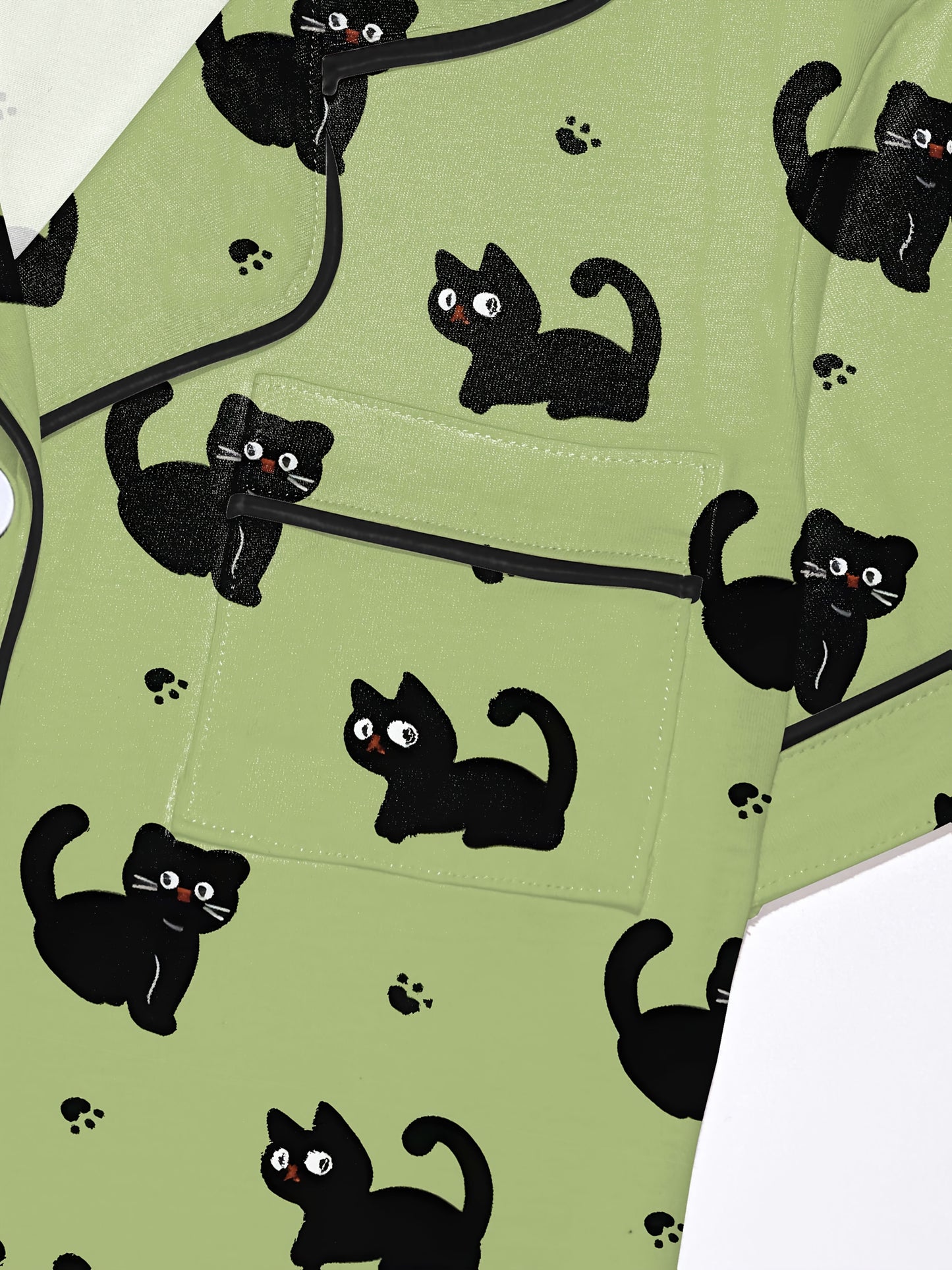 Pistachio silk‑touch modal short‑sleeve pajama set with black cat doodle print — button top with notch collar and elastic waist shorts with black piping