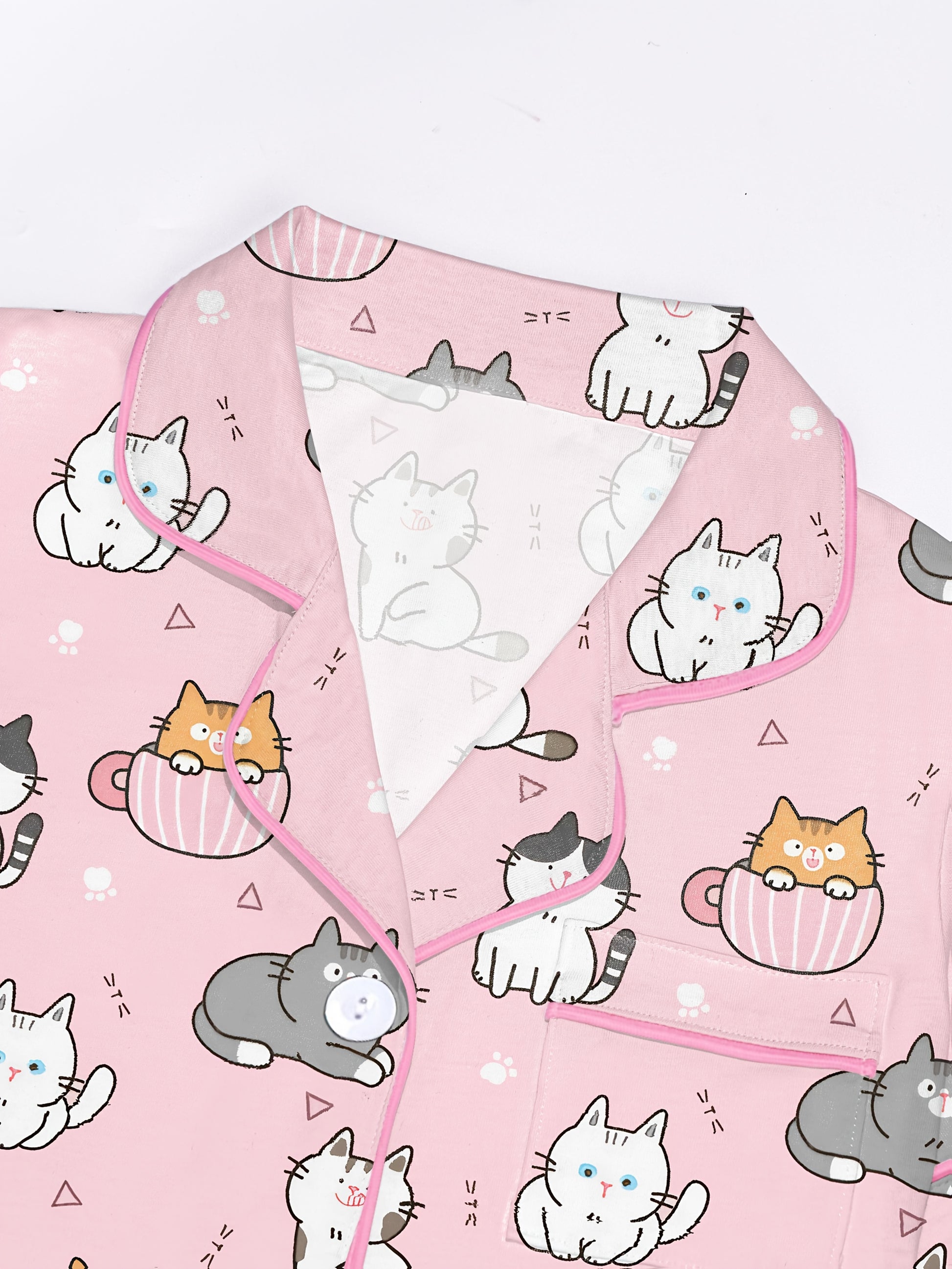 Blush modal short‑sleeve pajama set with playful cat doodle print — button top with notch collar and elastic waist shorts with pink piping