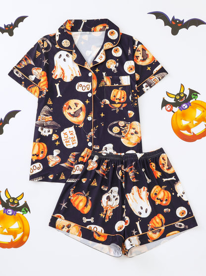 Navy silk‑touch modal short‑sleeve pajama top and elastic waist shorts with orange and white Halloween print, piped collar and pocket