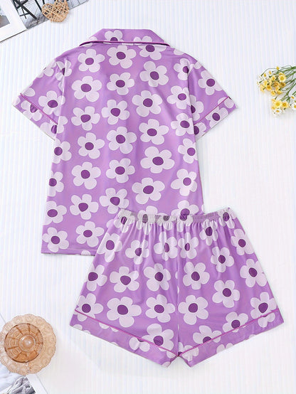 Periwinkle combed cotton short‑sleeve pajama top and elastic waist shorts with white daisy print and aqua piping