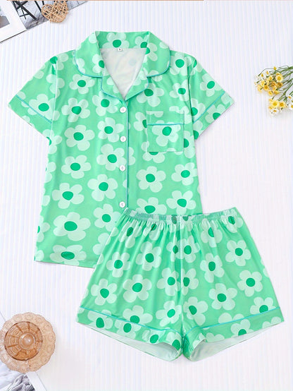 Periwinkle combed cotton short‑sleeve pajama top and elastic waist shorts with white daisy print and aqua piping