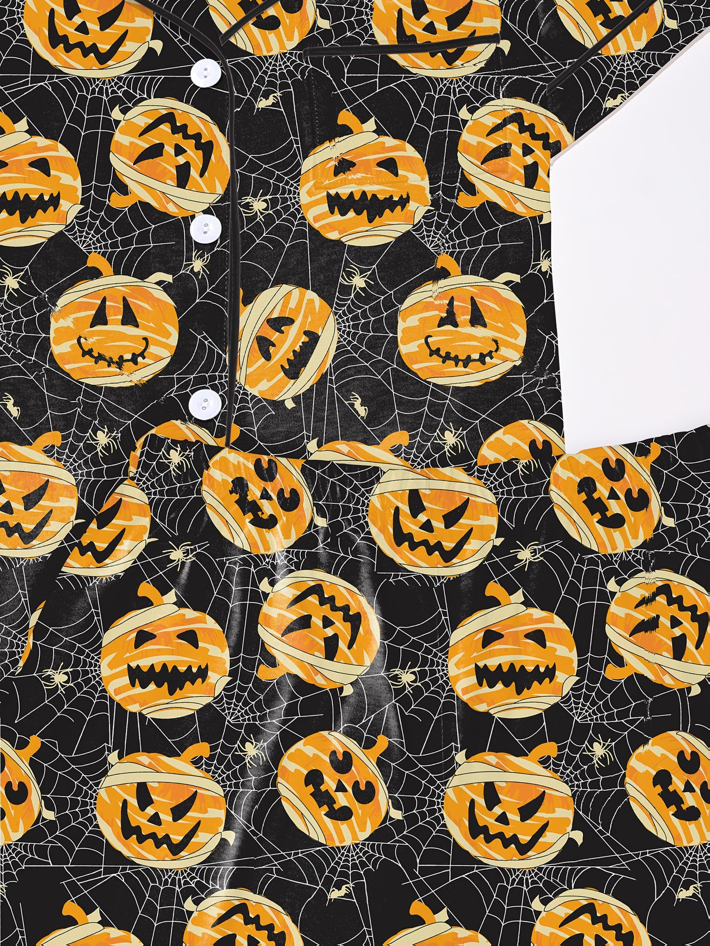 Black modal pajama set with orange jack‑o’‑lantern and spiderweb print — short sleeve button top and elastic waist shorts with piping