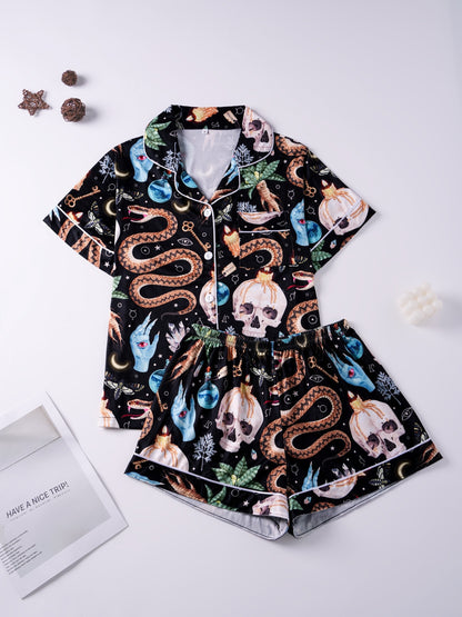Black modal pajama set with skulls, snake and crystal print — short‑sleeve button top and elastic waist shorts with pale piping