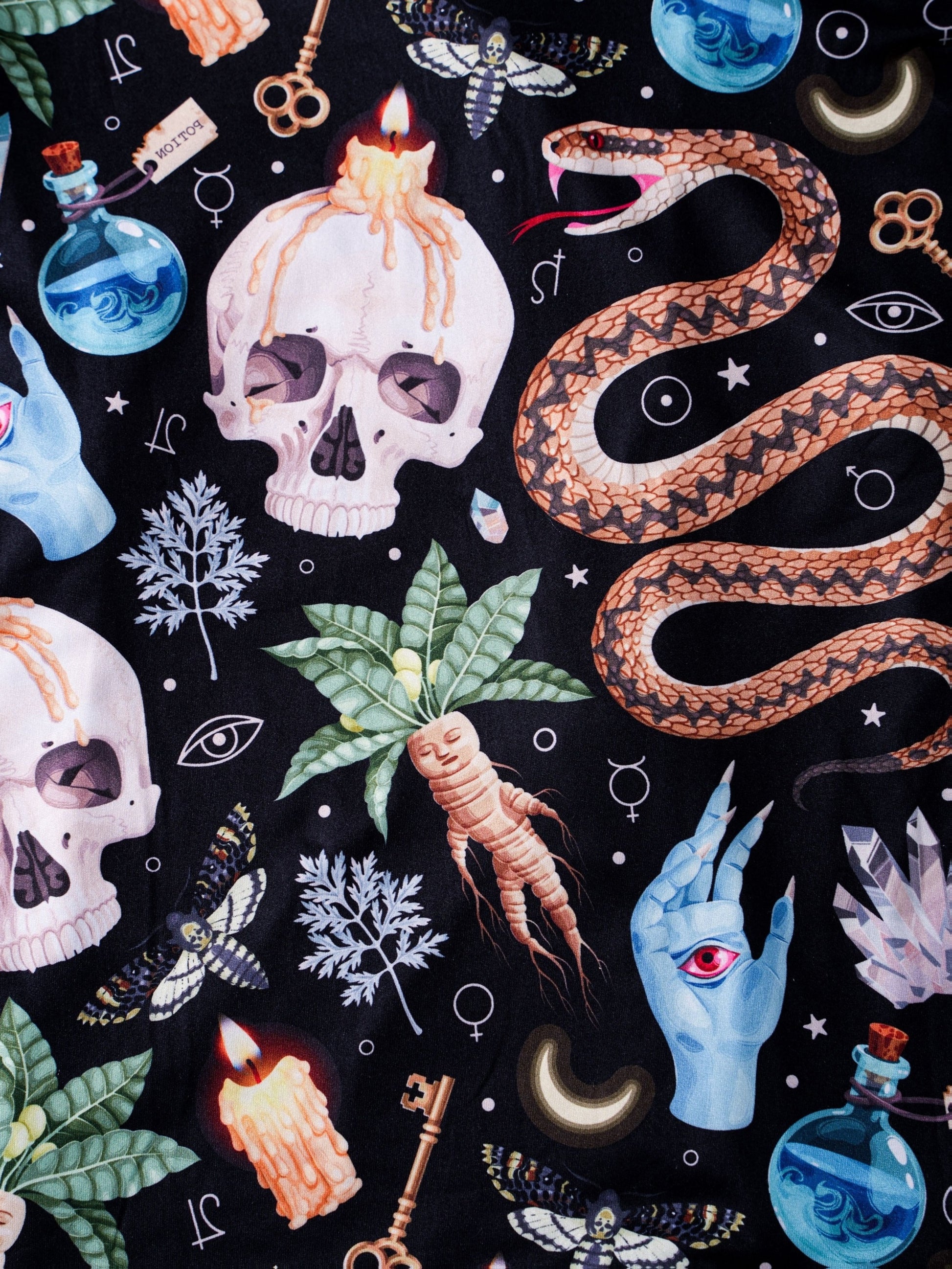 Black modal pajama set with skulls, snake and crystal print — short‑sleeve button top and elastic waist shorts with pale piping