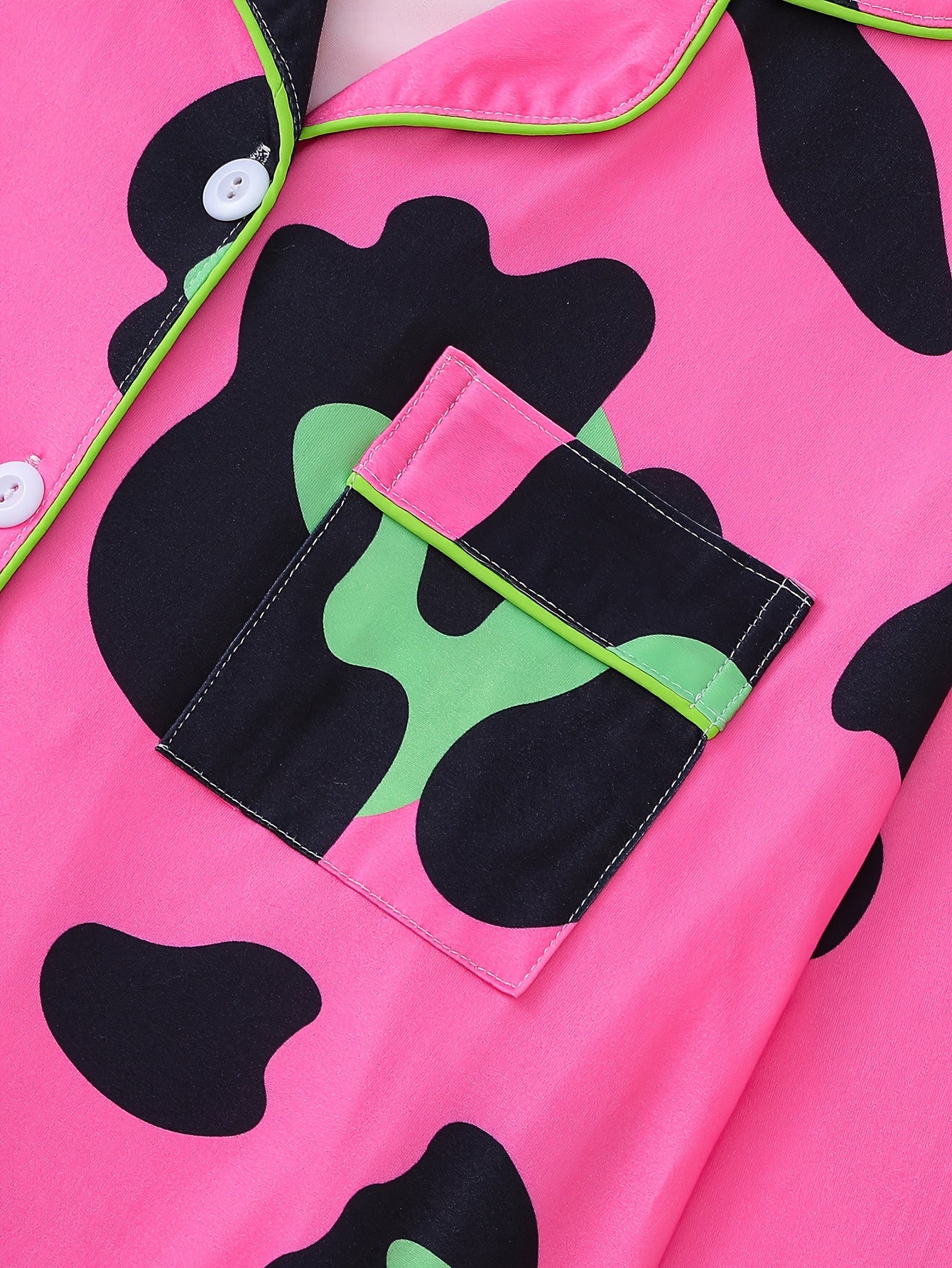 Neon cowhide satin-look short pajama set in bubblegum pink with black and lime spots, button-up short-sleeve top with chest pocket and elastic waist shorts, 95% Polyester/5% Elastane