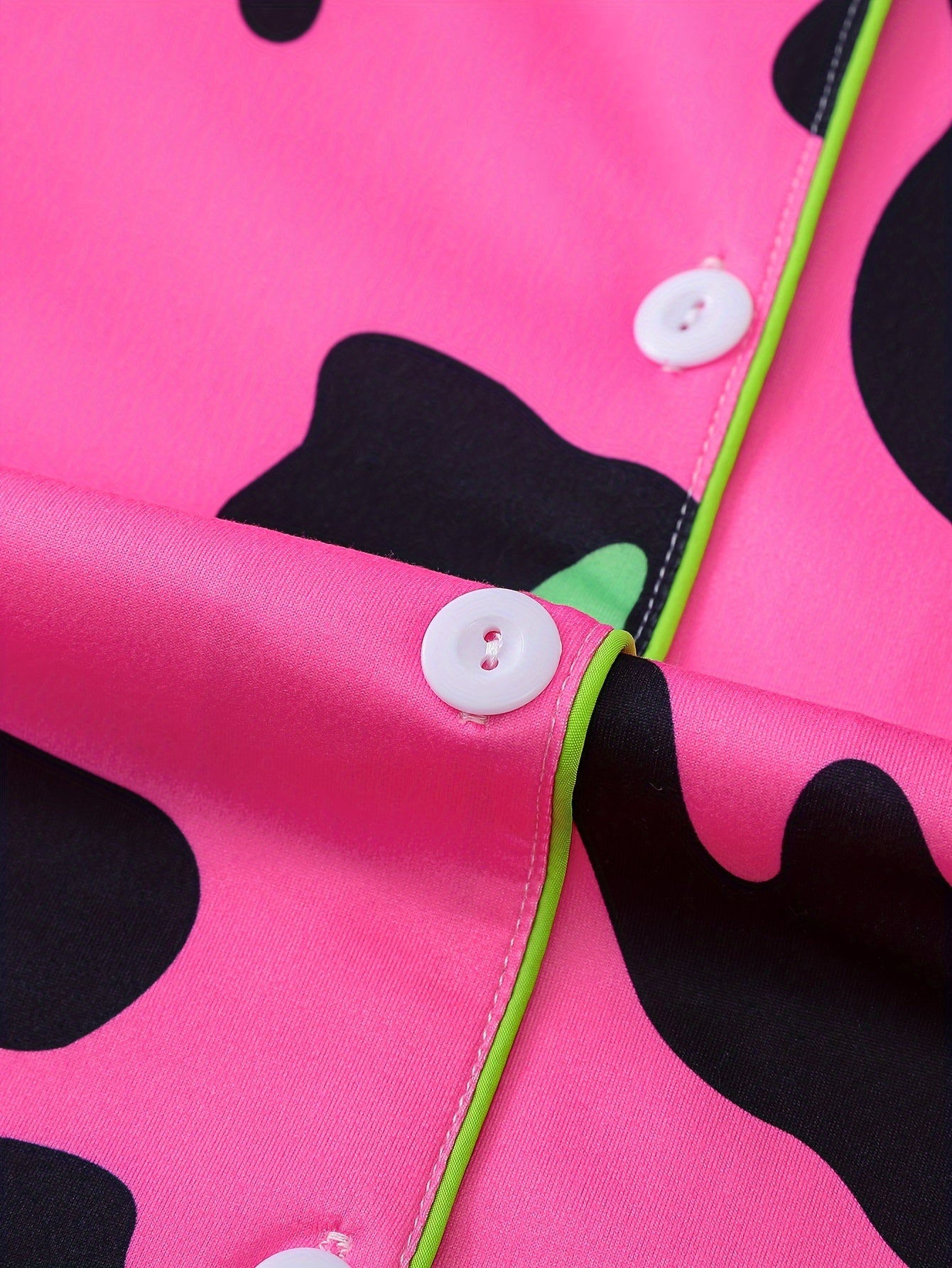 Neon cowhide satin-look short pajama set in bubblegum pink with black and lime spots, button-up short-sleeve top with chest pocket and elastic waist shorts, 95% Polyester/5% Elastane