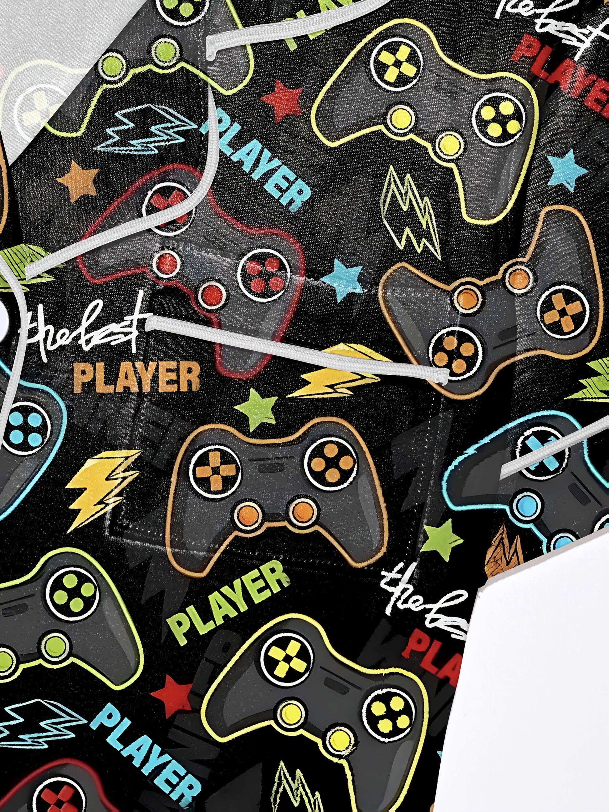 Satin‑look pajama set with neon game controllers, lightning bolts and “PLAYER” text on a black background — short‑sleeve button‑up top with chest pocket and elastic waist shorts