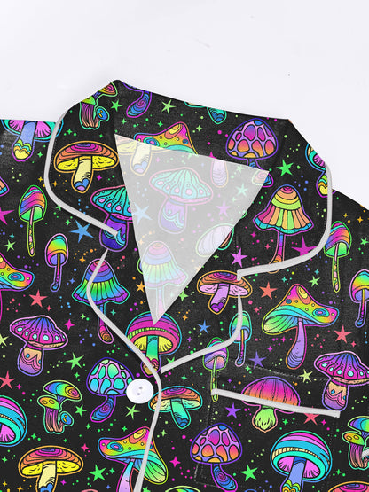 Black modal short‑sleeve pajama set with neon mushroom and star print — button top and elastic waist shorts with contrast piping