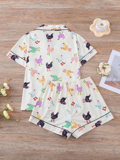 Cream satin-look short pajama set with pastel hen print — button-up short-sleeve top with chest pocket and elastic waist shorts, 95% Polyester/5% Elastane