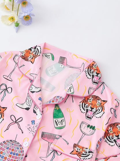 Pink satin-look short-sleeve pajama set with party tiger print, piped trim, chest pocket and elastic waist shorts in 95% Polyester 5% Elastane