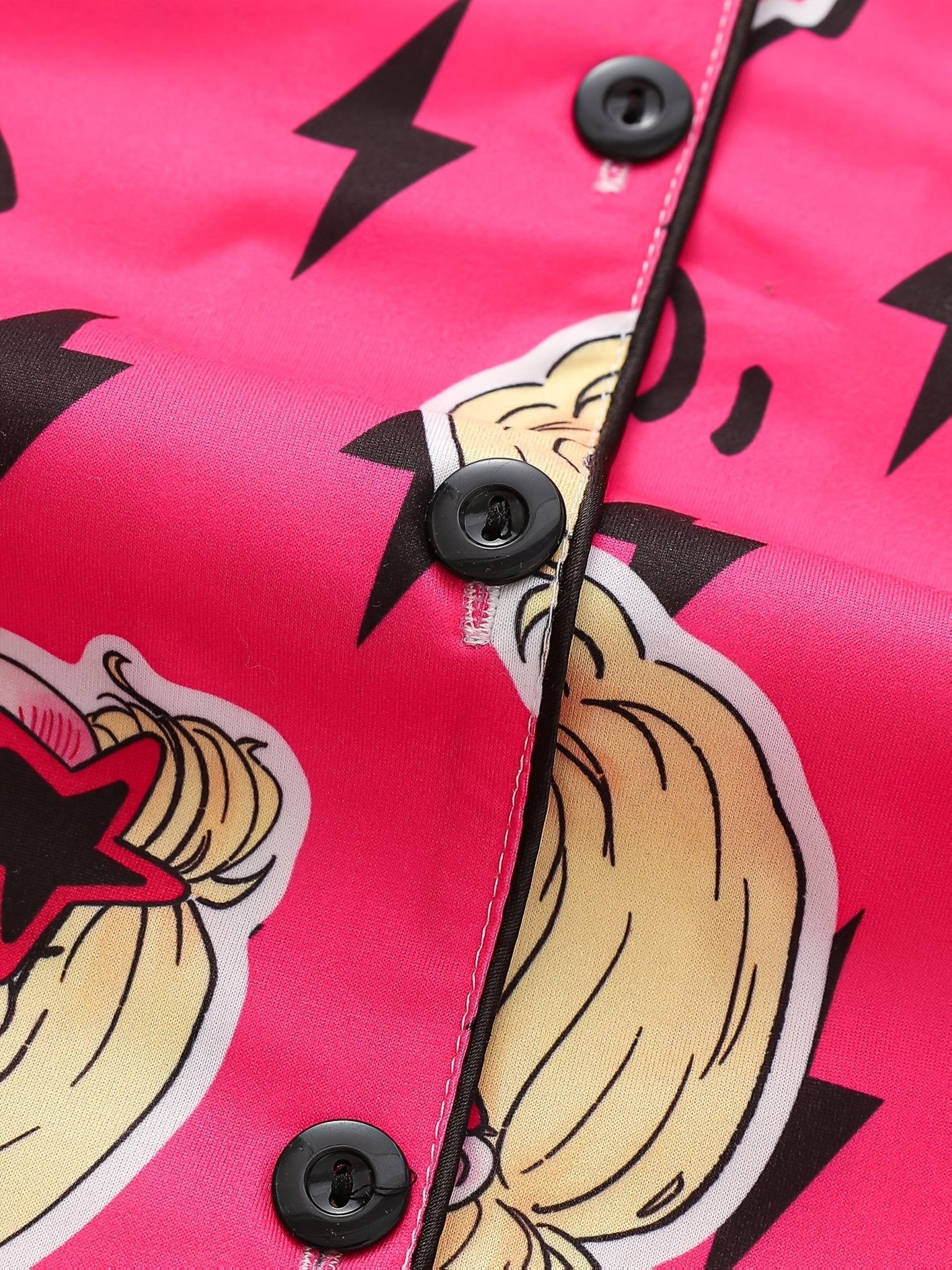 Bright pop-pink satin-look short-sleeve pajama set with guitar and star-sunglasses print, piped trim, chest pocket and elastic waist shorts in 95% Polyester 5% Elastane — silky stretch travel-ready loungewear