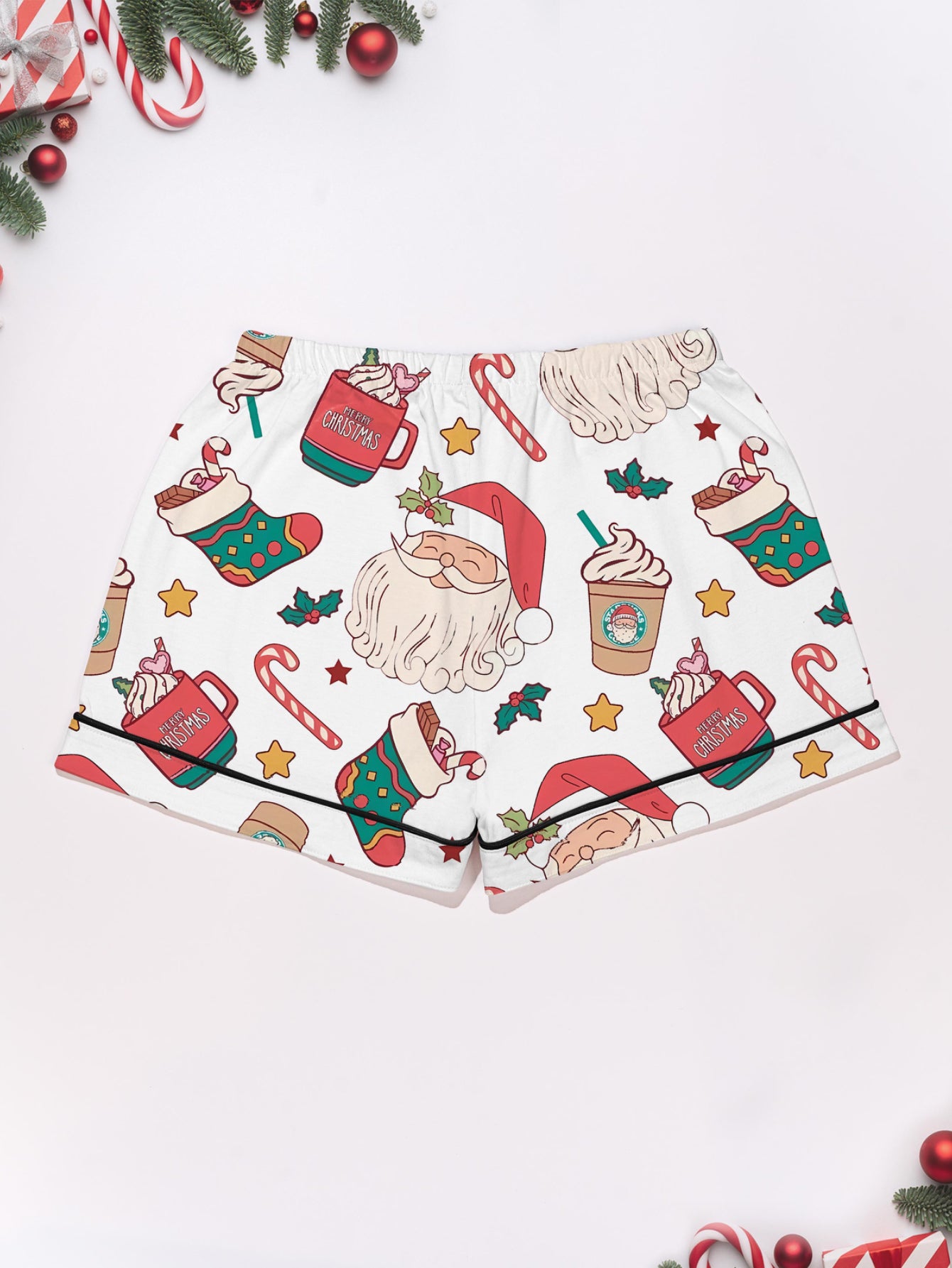 Cream modal pajama set with Santa faces and cocoa mugs print — short‑sleeve button top and elastic waist shorts with piping