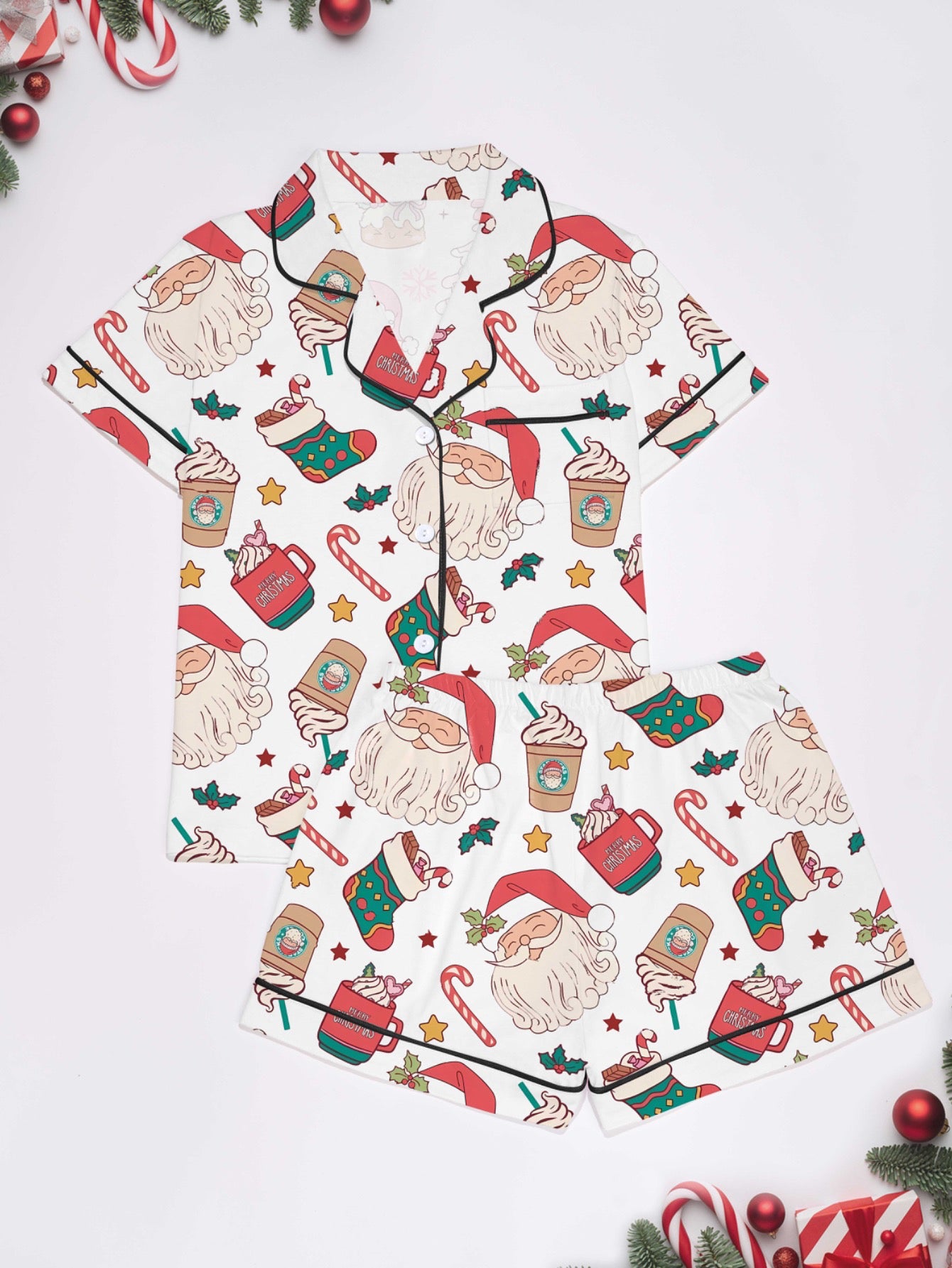 Cream modal pajama set with Santa faces and cocoa mugs print — short‑sleeve button top and elastic waist shorts with piping