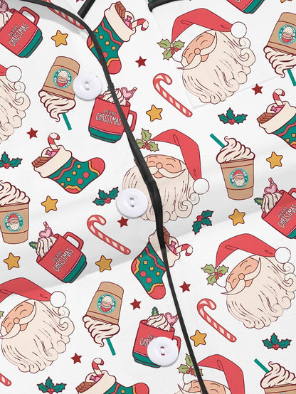 Cream modal pajama set with Santa faces and cocoa mugs print — short‑sleeve button top and elastic waist shorts with piping