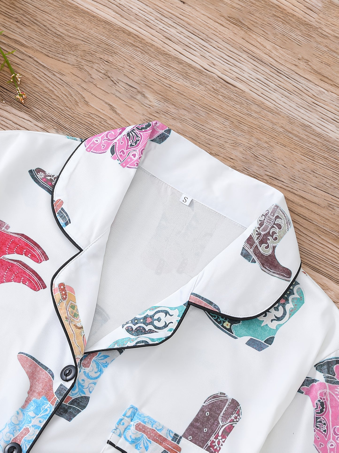 Silk‑touch modal short‑sleeve pajama top and elastic waist shorts with contrast piping and pastel print