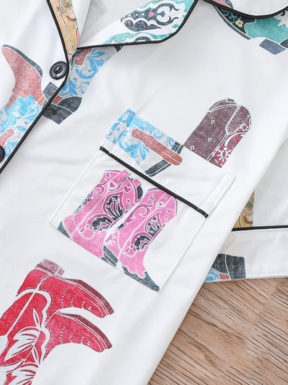 Silk‑touch modal short‑sleeve pajama top and elastic waist shorts with contrast piping and pastel print