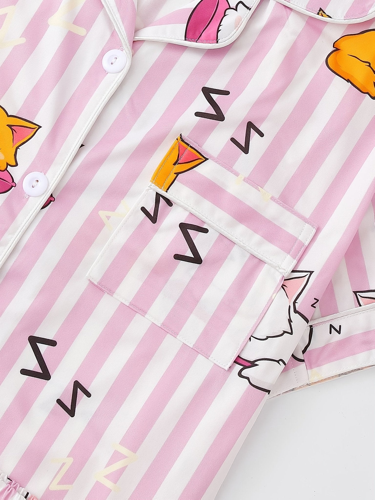 Pink stripe satin-look short-sleeve pajama set with orange and white sleeping cat print, piped trim, chest pocket and elastic waist shorts in 95% Polyester 5% Elastane — silky stretch travel-ready loungewear