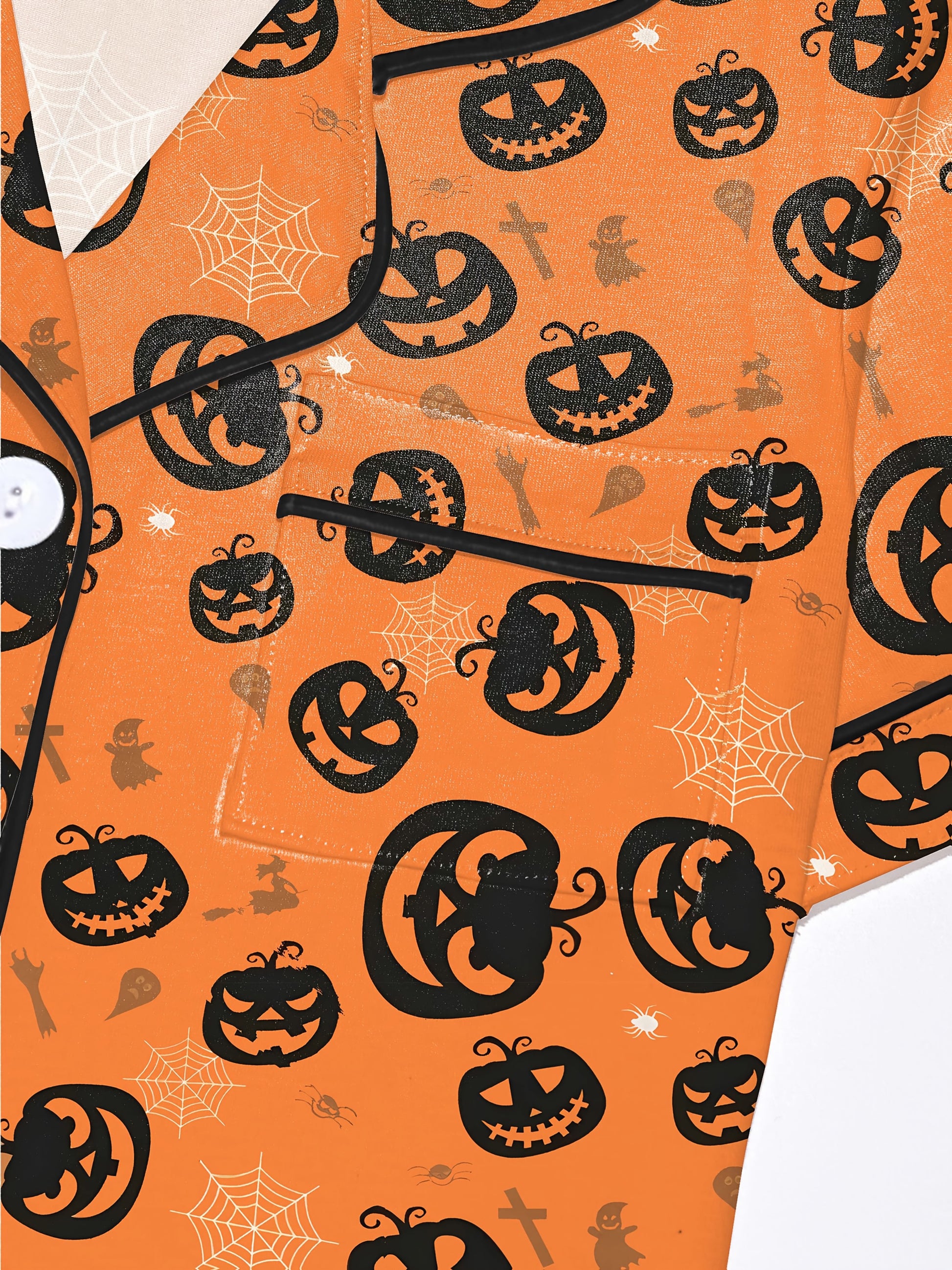 Warm pumpkin modal short‑sleeve pajama set with jack‑o‑lantern and spiderweb print — button top and elastic waist shorts with black piping