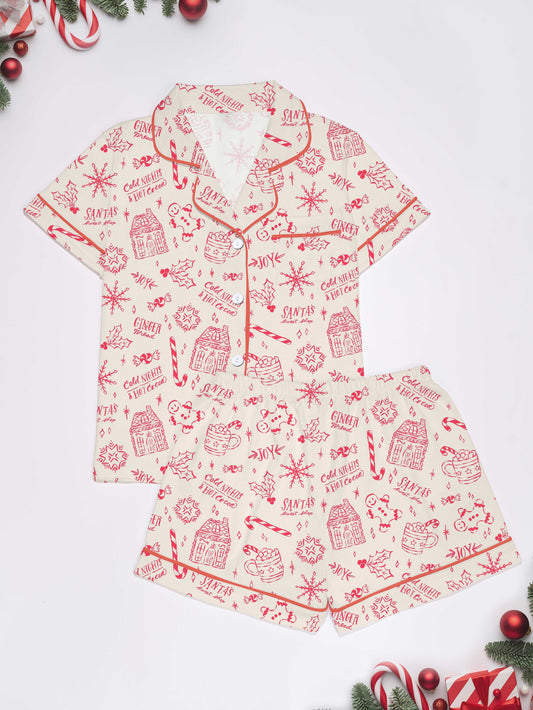 Cream short-sleeve women’s pajama set with red holiday sketch print of gingerbread houses, candy canes and cocoa mugs — short top and elastic waist shorts in 95% polyester 5% elastane