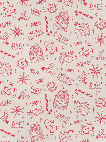 Cream short-sleeve women’s pajama set with red holiday sketch print of gingerbread houses, candy canes and cocoa mugs — short top and elastic waist shorts in 95% polyester 5% elastane