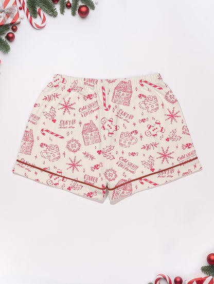 Cream short-sleeve women’s pajama set with red holiday sketch print of gingerbread houses, candy canes and cocoa mugs — short top and elastic waist shorts in 95% polyester 5% elastane