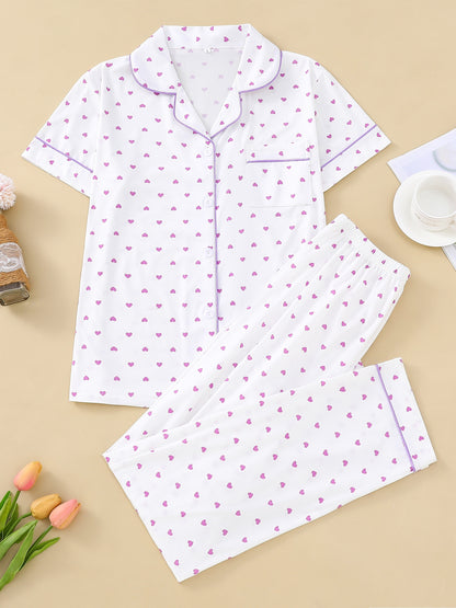 Cream satin-look pajama set with small yellow heart print — short-sleeve button-up top with chest pocket and elastic waist pants, 95% Polyester/5% Elastane