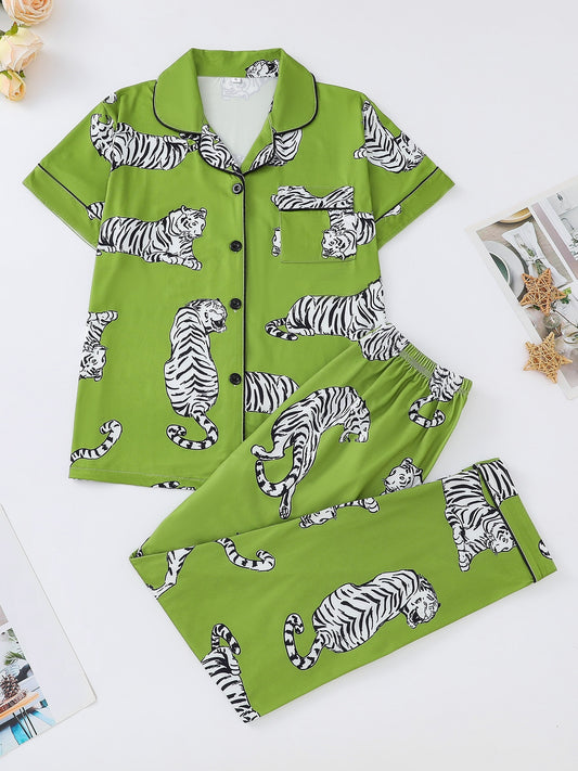 Silk‑touch modal short‑sleeve pajama top and elastic waist shorts with contrast piping and playful print