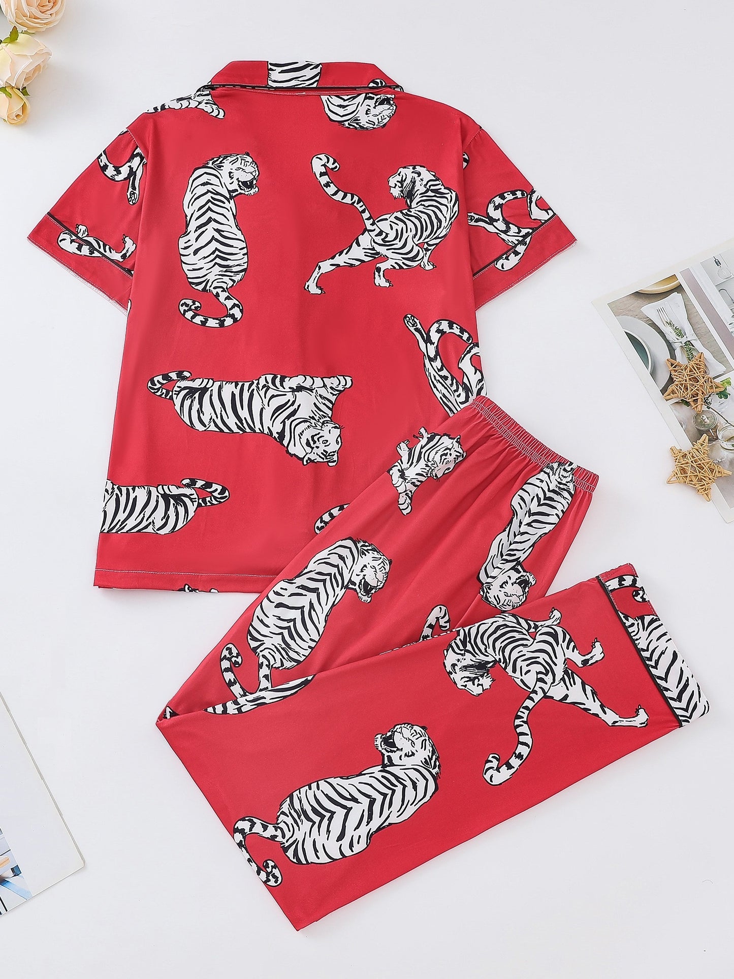 Silk‑touch modal short‑sleeve pajama top and elastic waist shorts with contrast piping and playful print