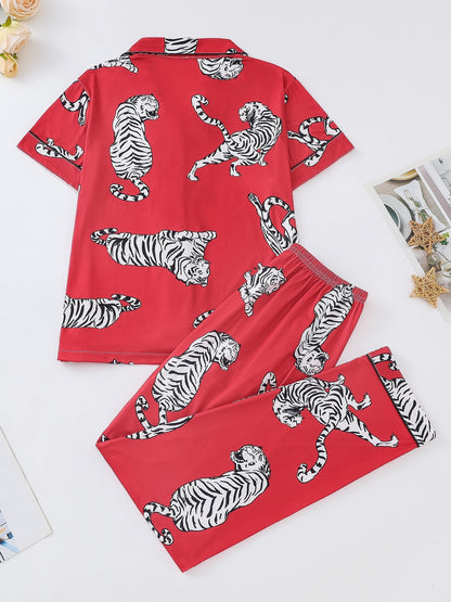 Silk‑touch modal short‑sleeve pajama top and elastic waist shorts with contrast piping and playful print