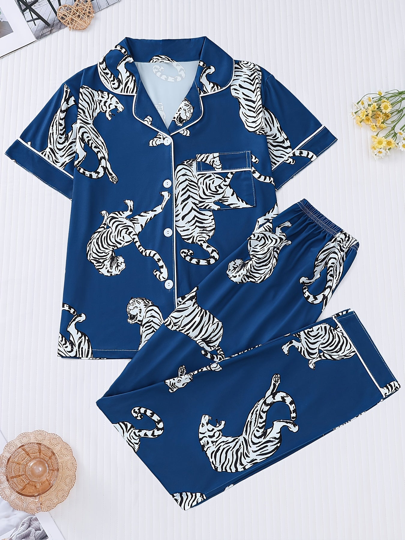 Silk‑touch modal short‑sleeve pajama top and elastic waist shorts with contrast piping and playful print