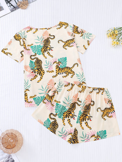 Cream satin-look short pajama set with watercolor tiger and palm-leaf print — short-sleeve relaxed top and elastic waist shorts, 95% Polyester/5% Elastane, lightweight and breathable