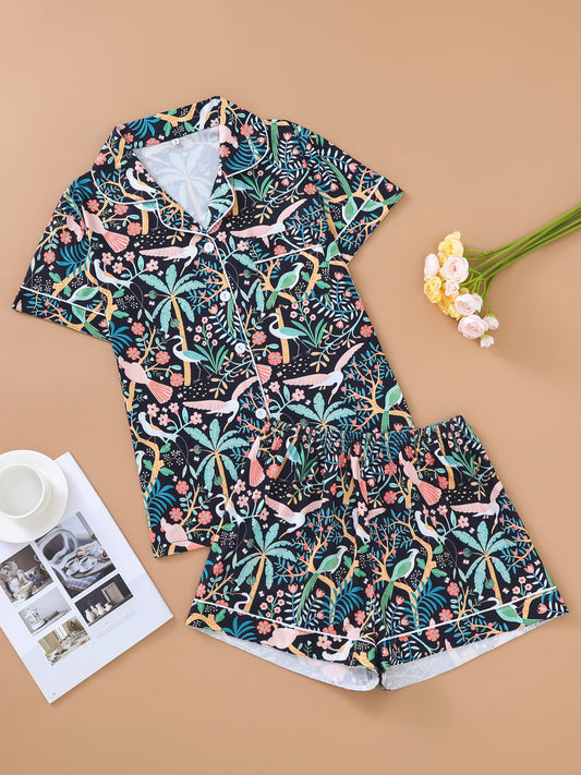 Tropical bird print satin-look short sleeve pajama set with piped trim, chest pocket and elastic waist shorts in silky stretch fabric — 95% Polyester 5% Elastane