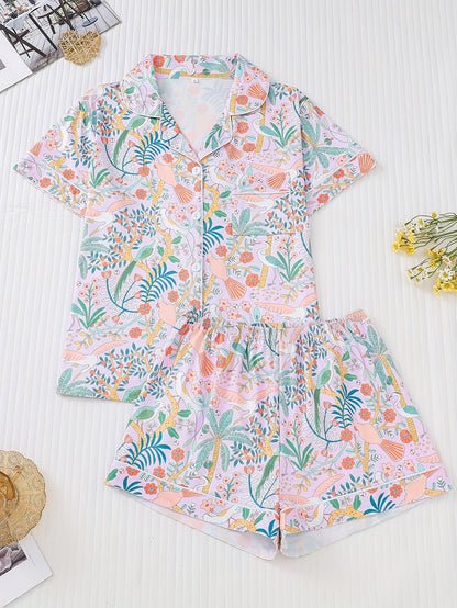 Tropical bird print satin-look short sleeve pajama set with piped trim, chest pocket and elastic waist shorts in silky stretch fabric — 95% Polyester 5% Elastane
