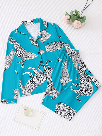 Turquoise satin-look pajama set with black-and-white panther print — long-sleeve button-up top with chest pocket and elastic waist pants, 95% Polyester/5% Elastane