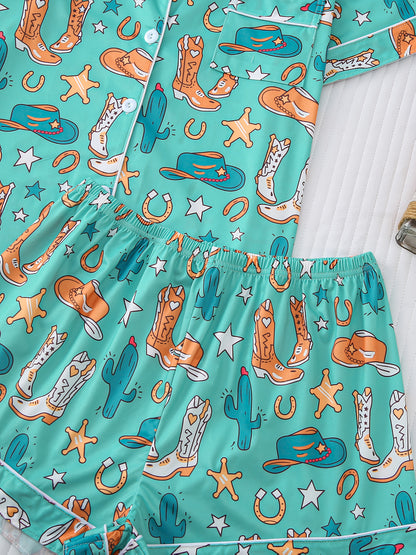 Turquoise satin-look pajama set with western boot and horseshoe print — short-sleeve button-up top with chest pocket and elastic waist shorts, 95% Polyester/5% Elastane