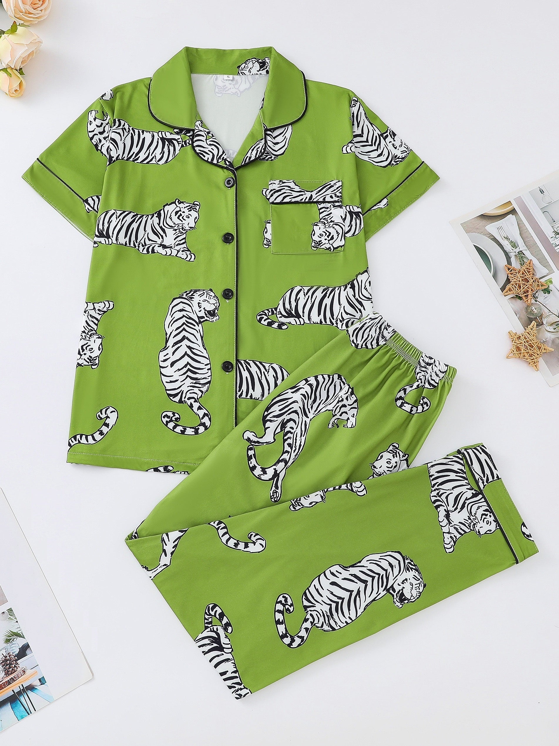 Silk‑touch modal short‑sleeve pajama top and elastic waist shorts with contrast piping and playful print