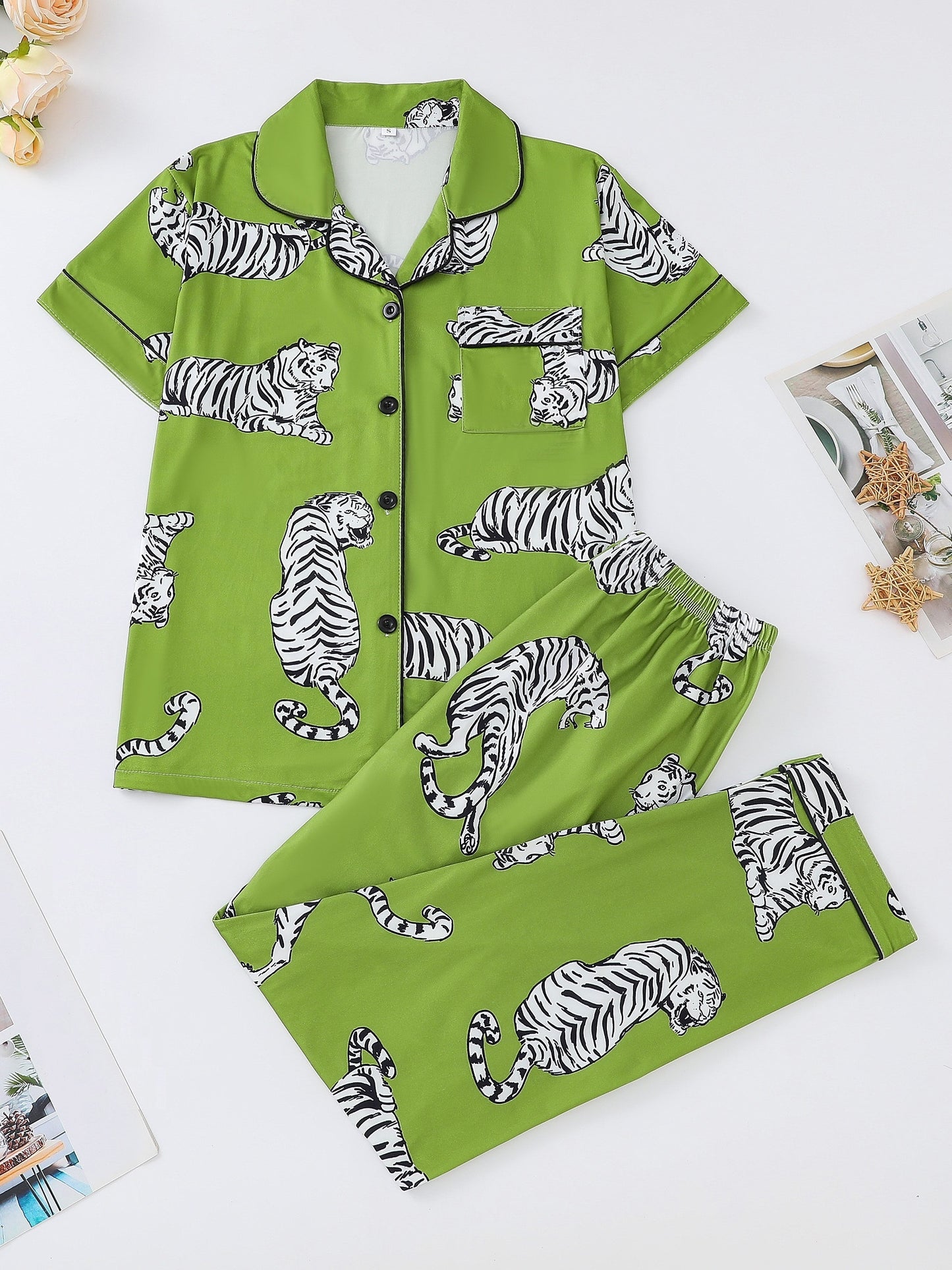 Silk‑touch modal short‑sleeve pajama top and elastic waist shorts with contrast piping and playful print