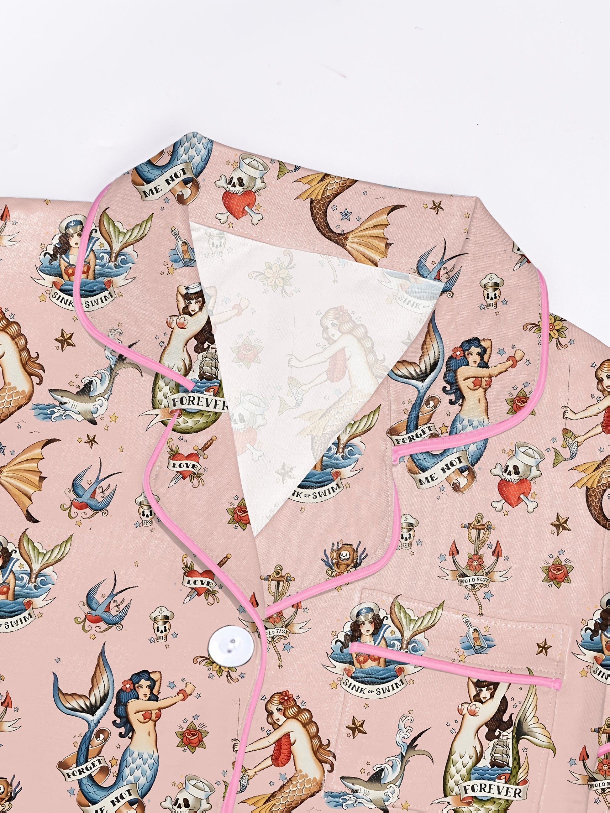 Blush modal short‑sleeve pajama set with vintage mermaid tattoo print — button top with notch collar and elastic waist shorts with pink piping