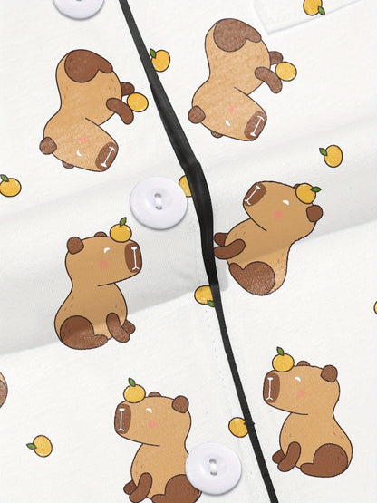 White short-sleeve pajama set with brown bear and yellow pear print — button-up top and elastic waist shorts with black piping