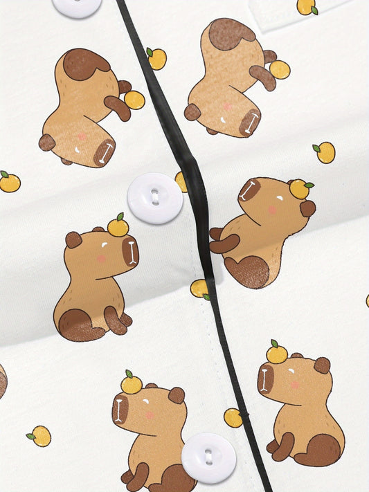 White short-sleeve pajama set with brown bear and yellow pear print — button-up top and elastic waist shorts with black piping