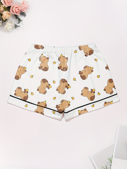 White short-sleeve pajama set with brown bear and yellow pear print — button-up top and elastic waist shorts with black piping