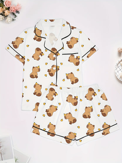 White short-sleeve pajama set with brown bear and yellow pear print — button-up top and elastic waist shorts with black piping